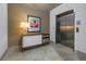Stylish condo elevator with artwork and cabinet at 400 4Th S Ave # 506, St Petersburg, FL 33701