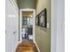 Bright hallway with hardwood floors and artwork at 400 4Th S Ave # 506, St Petersburg, FL 33701