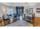 Open concept living room, kitchen and dining area with hardwood floors and city views at 400 4Th S Ave # 506, St Petersburg, FL 33701