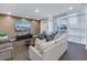 Relaxing lounge with comfortable seating, large TV, and access to outdoor patio at 400 4Th S Ave # 506, St Petersburg, FL 33701