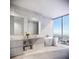 Modern bathroom with double vanity and large bathtub at 400 Central Ave # Ph-B, St Petersburg, FL 33701