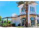 Community clubhouse with large windows and palm trees at 4319 Pullet Ct, Bradenton, FL 34211