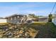 View of house from the side yard, showing shed at 4416 W Bay Ave, Tampa, FL 33616