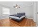 Grey bedroom with terracotta tile floors and a ceiling fan at 5012 Starfish Se Dr # C, St Petersburg, FL 33705