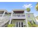 Two-story building with balcony and white staircase at 5012 Starfish Se Dr # C, St Petersburg, FL 33705