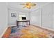 Bright home office features terracotta tile floors and a ceiling fan at 5012 Starfish Se Dr # C, St Petersburg, FL 33705