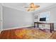 Bright home office features terracotta tile floors and a ceiling fan at 5012 Starfish Se Dr # C, St Petersburg, FL 33705