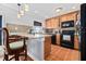 Modern kitchen with granite countertops and wood cabinets at 5012 Starfish Se Dr # C, St Petersburg, FL 33705