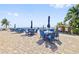 Community patio with tables, chairs, and waterfront views at 5012 Starfish Se Dr # C, St Petersburg, FL 33705