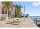 Community patio with lounge chairs and waterfront views at 5012 Starfish Se Dr # C, St Petersburg, FL 33705