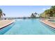 Resort-style pool and hot tub with patio seating at 5012 Starfish Se Dr # C, St Petersburg, FL 33705