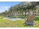 Shuffleboard court and wooden chair near homes at 5012 Starfish Se Dr # C, St Petersburg, FL 33705