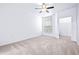 Bright bedroom with ceiling fan and carpeting at 5513 Legacy Crescent Pl # 303, Riverview, FL 33578