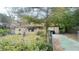 Tan brick ranch home with driveway and yard at 6405 Riverbend Cir, Tampa, FL 33610