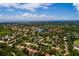 Aerial view of waterfront community with lush landscaping at 661 Segovia Ne Ct, St Petersburg, FL 33703