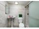 Clean bathroom featuring a pedestal sink and shower at 661 Segovia Ne Ct, St Petersburg, FL 33703