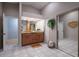 Elegant bathroom with a double vanity and tiled floor at 661 Segovia Ne Ct, St Petersburg, FL 33703