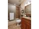 Updated bathroom with granite vanity, tile flooring and shower at 661 Segovia Ne Ct, St Petersburg, FL 33703