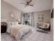 Primary bedroom with a king-size bed and ceiling fan at 661 Segovia Ne Ct, St Petersburg, FL 33703