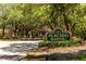 Community entrance with gated access and signage at 661 Segovia Ne Ct, St Petersburg, FL 33703