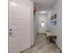 Inviting entryway with a bench and tiled floor at 661 Segovia Ne Ct, St Petersburg, FL 33703