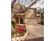 Tan two-story townhome with attached garage and landscaped garden at 661 Segovia Ne Ct, St Petersburg, FL 33703