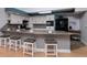 Modern kitchen with white cabinets, granite countertops and breakfast bar at 661 Segovia Ne Ct, St Petersburg, FL 33703