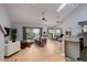Open living space with hardwood floors, vaulted ceilings and modern furniture at 661 Segovia Ne Ct, St Petersburg, FL 33703