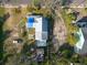 Aerial view of a house, yard, and neighboring properties at 7408 S Elliott St, Tampa, FL 33616