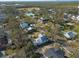 Aerial view of a house and surrounding area, near water at 7408 S Elliott St, Tampa, FL 33616