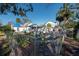 Backyard with a shed and a chain-link fence. Overgrown plants visible at 7408 S Elliott St, Tampa, FL 33616