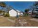 House's backyard with a chain link fence, shed, and some plants at 7408 S Elliott St, Tampa, FL 33616