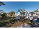 Backyard with a shed, a chain link fence, and some overgrown vegetation at 7408 S Elliott St, Tampa, FL 33616