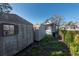Two sheds in the backyard of the property, with overgrown vegetation at 7408 S Elliott St, Tampa, FL 33616