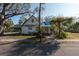 Charming one-story home with a covered porch and mature landscaping at 7408 S Elliott St, Tampa, FL 33616