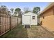 White storage shed with a ramp for easy access at 8428 Parkwood Blvd, Seminole, FL 33777