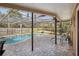 Relaxing swimming pool with covered patio at 8428 Parkwood Blvd, Seminole, FL 33777