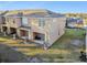 Rear view of townhouse showing patio and AC units at 8841 Walnut Gable Ct, Riverview, FL 33578