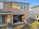 Backyard view of the townhome, showing patio and AC units at 8841 Walnut Gable Ct, Riverview, FL 33578