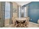 Dining area with round table and four chairs near window at 8841 Walnut Gable Ct, Riverview, FL 33578