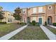 Attractive townhome with teal doors and walkway at 8841 Walnut Gable Ct, Riverview, FL 33578