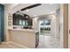Kitchen boasts dark cabinets, granite counters, and a breakfast bar at 8841 Walnut Gable Ct, Riverview, FL 33578