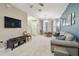 Living room with TV, sofa and dining area at 8841 Walnut Gable Ct, Riverview, FL 33578