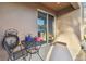 Private patio with small table and chairs, perfect for outdoor relaxation at 8841 Walnut Gable Ct, Riverview, FL 33578
