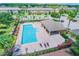 Community pool with a cabana, surrounded by lush landscaping at 8841 Walnut Gable Ct, Riverview, FL 33578