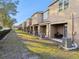Row of townhomes with private patios and backyards at 8841 Walnut Gable Ct, Riverview, FL 33578