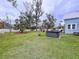 Large backyard with a hot tub, gazebo and lush landscaping at 908 E Gilchrist St, Plant City, FL 33563