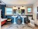 Bathroom with double pedestal sinks, newspaper wallpaper, and a clawfoot tub at 908 E Gilchrist St, Plant City, FL 33563