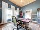 Home office with wood ceiling, built-ins and a large work desk at 908 E Gilchrist St, Plant City, FL 33563