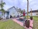 Large backyard patio with dining set, hot tub, and string lights at 908 E Gilchrist St, Plant City, FL 33563